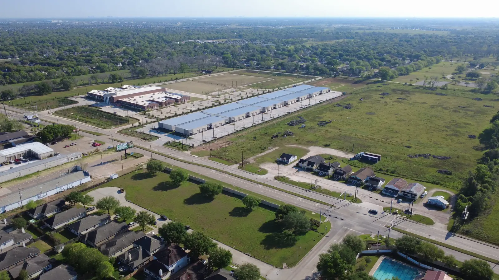 Aerial photo of Highline Business Park on FM 359 with the school next door, its sports fields and nearby neighborhoods
